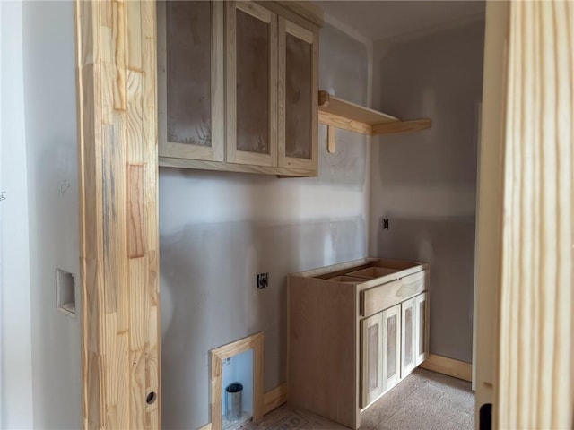 clothes washing area with cabinet space and electric dryer hookup