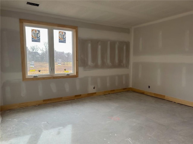 empty room featuring baseboards, visible vents, and concrete flooring