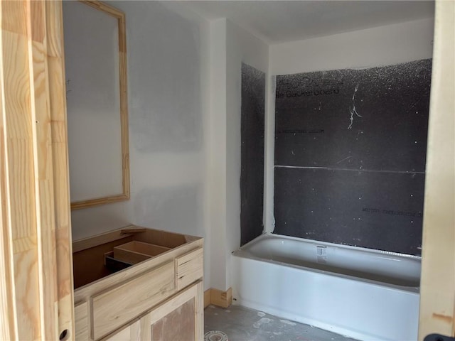 full bath featuring shower / bath combination and unfinished concrete flooring