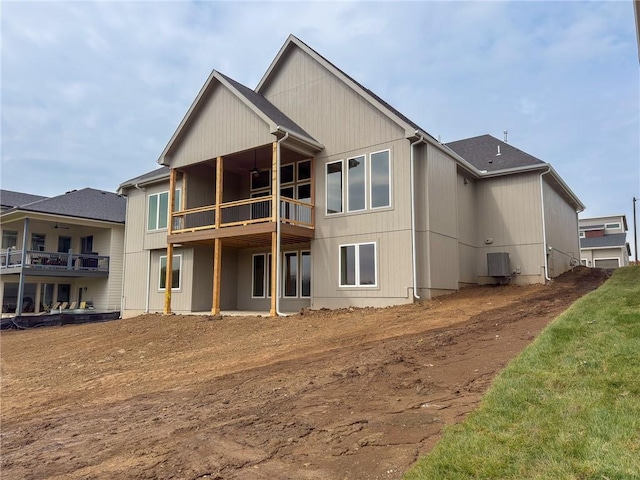 back of property with a balcony