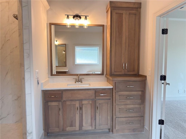 bathroom with vanity and tiled shower