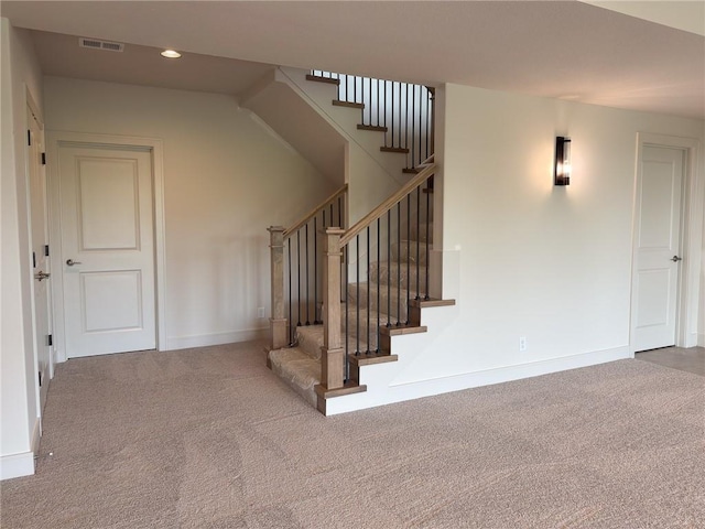stairway featuring carpet floors, recessed lighting, baseboards, and visible vents