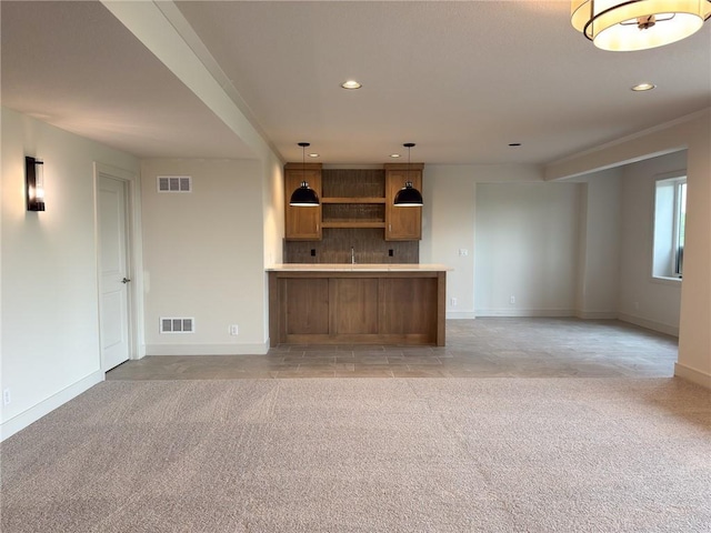 unfurnished living room with recessed lighting, light colored carpet, and visible vents