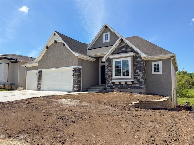 craftsman-style house featuring stucco siding, stone siding, and a garage