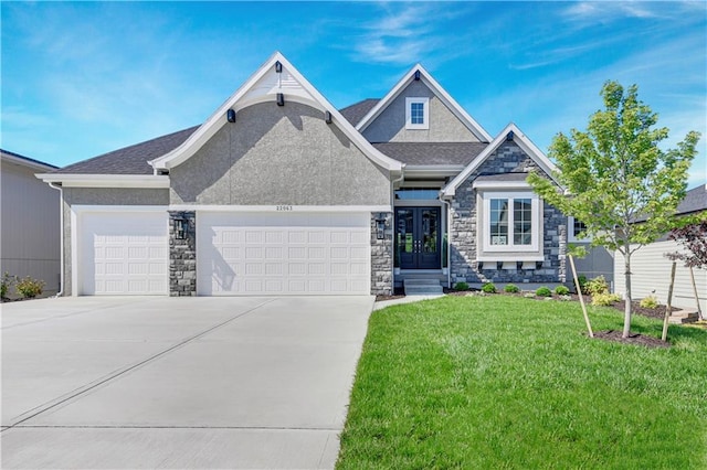 22063 W 100th Ter, Lenexa, KS 66220 - view of front of house featuring stone siding, an attached garage, a front lawn, and french doors