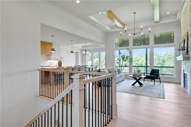22063 W 100th Ter, Lenexa, KS 66220 - corridor featuring light wood-style flooring, a chandelier, recessed lighting, an upstairs landing, and a high ceiling