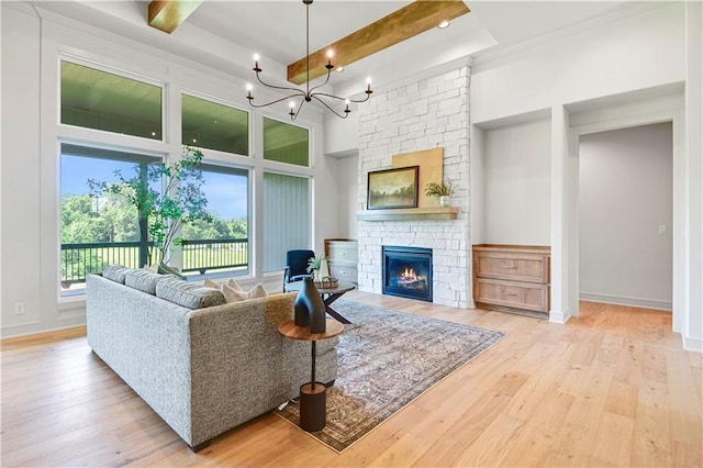 22063 W 100th Ter, Lenexa, KS 66220 - living room with hardwood / wood-style flooring, a fireplace, beam ceiling, a chandelier, and a high ceiling