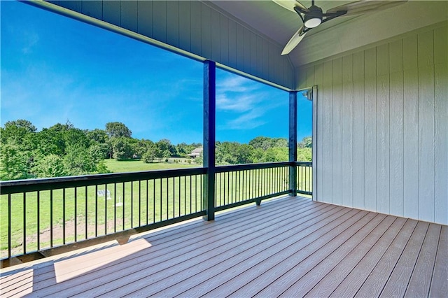 22063 W 100th Ter, Lenexa, KS 66220 - wooden terrace with a ceiling fan, a yard, and view of wooded area