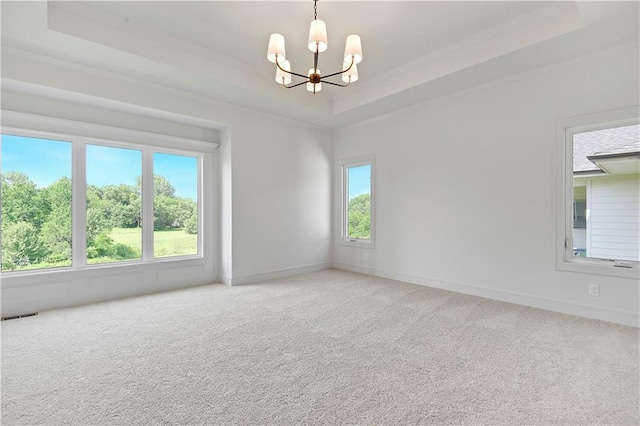 22063 W 100th Ter, Lenexa, KS 66220 - unfurnished room featuring a raised ceiling, a chandelier, carpet floors, and ornamental molding