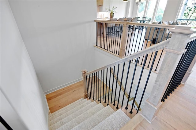 22063 W 100th Ter, Lenexa, KS 66220 - staircase with wood finished floors and baseboards