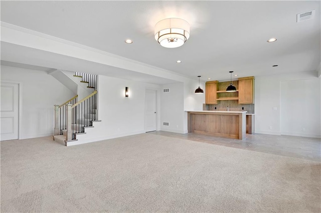 22063 W 100th Ter, Lenexa, KS 66220 - unfurnished living room with light colored carpet, recessed lighting, and stairs
