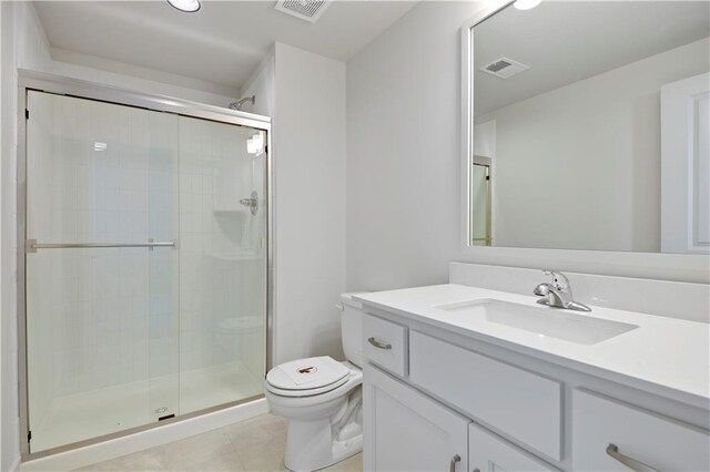 22063 W 100th Ter, Lenexa, KS 66220 - bathroom featuring vanity, a stall shower, and tile patterned floors