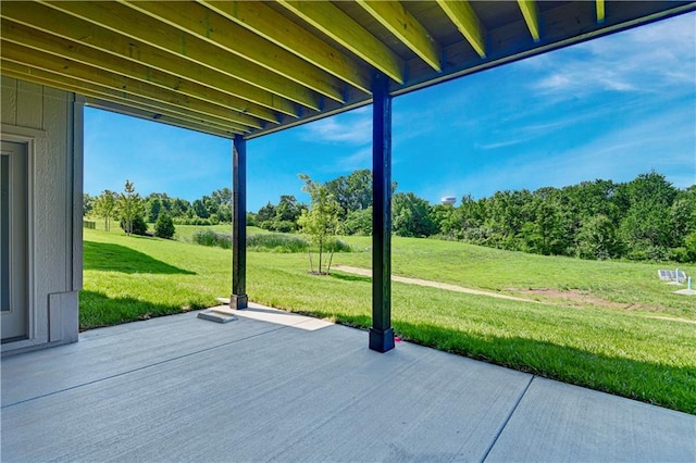 22063 W 100th Ter, Lenexa, KS 66220 - view of patio / terrace featuring view of wooded area
