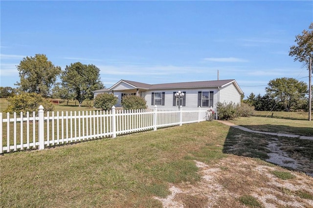 ranch-style home with a front yard