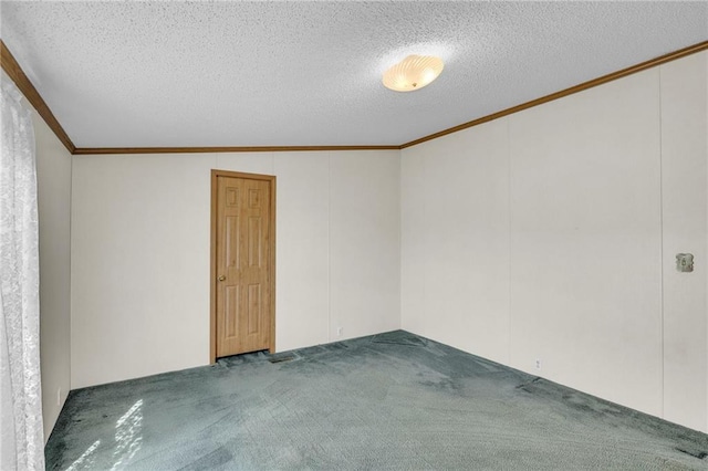 carpeted spare room featuring a textured ceiling, lofted ceiling, and crown molding