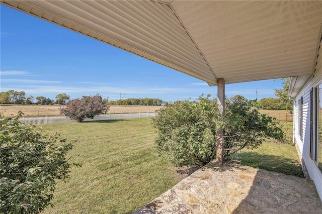 view of yard featuring a rural view and a patio area