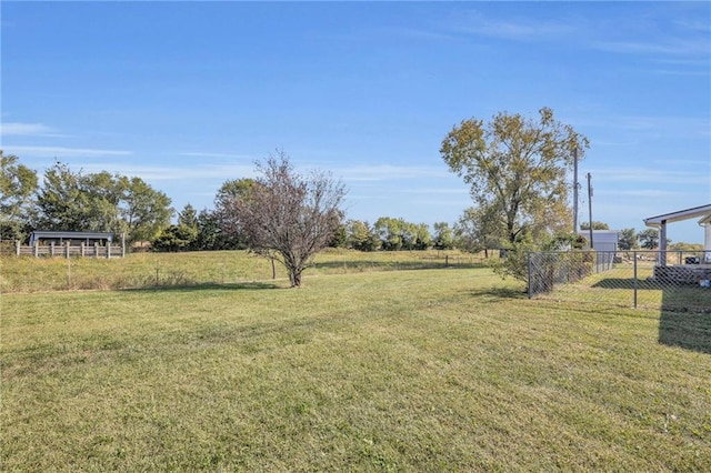 view of yard with a rural view