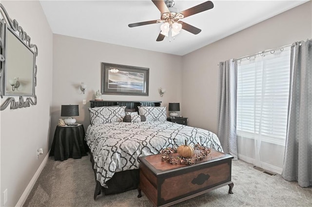 bedroom with light carpet and ceiling fan