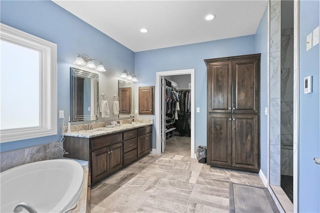 bathroom with separate shower and tub and vanity