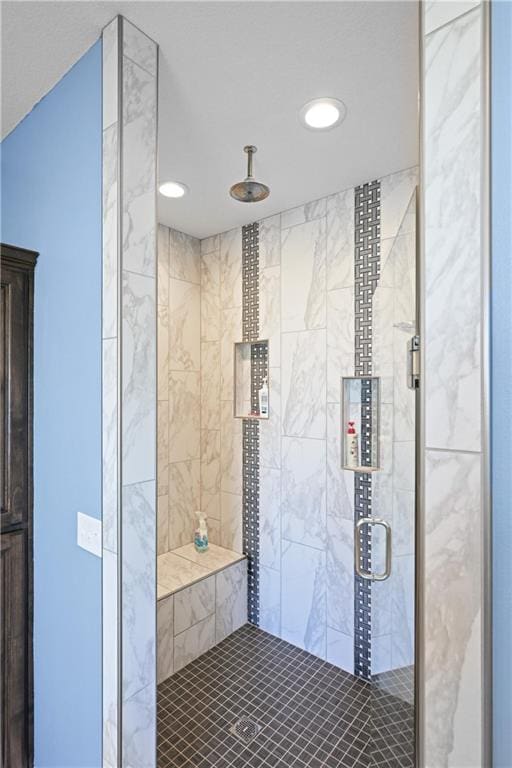 bathroom with a shower with shower door