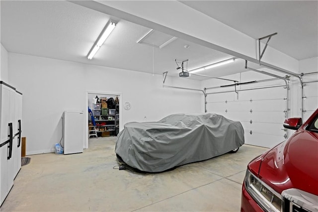 garage featuring a garage door opener