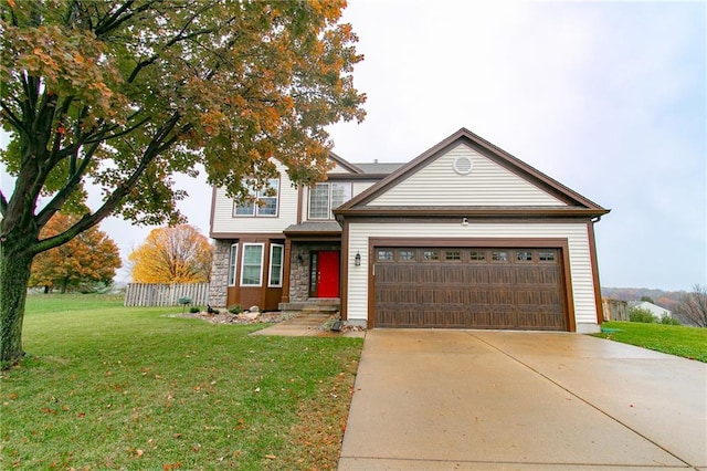 view of front of property featuring a garage and a front yard