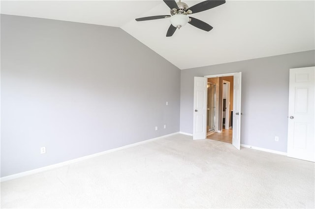 unfurnished bedroom with lofted ceiling, light colored carpet, and ceiling fan