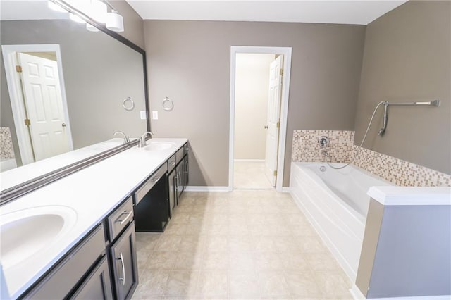 bathroom featuring a tub to relax in and vanity