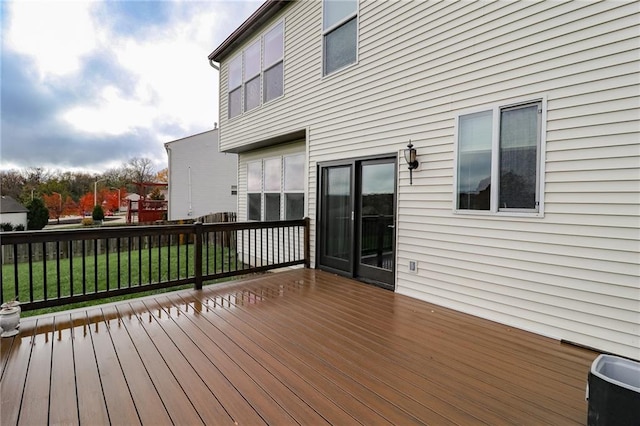 wooden terrace with a yard