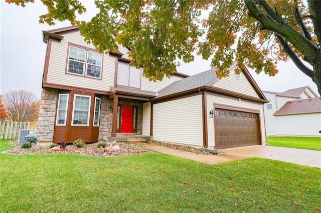 view of front of home with a garage, central AC unit, and a front lawn