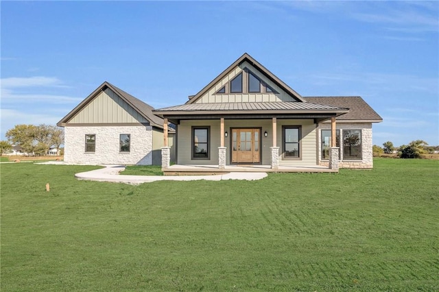 view of front facade with a front lawn and a porch