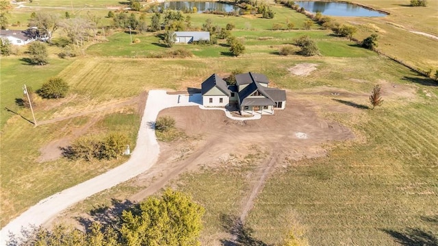 bird's eye view with a water view and a rural view