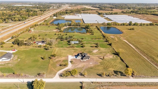 aerial view featuring a rural view and a water view