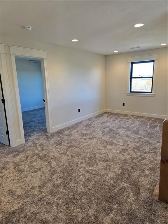 spare room featuring carpet flooring