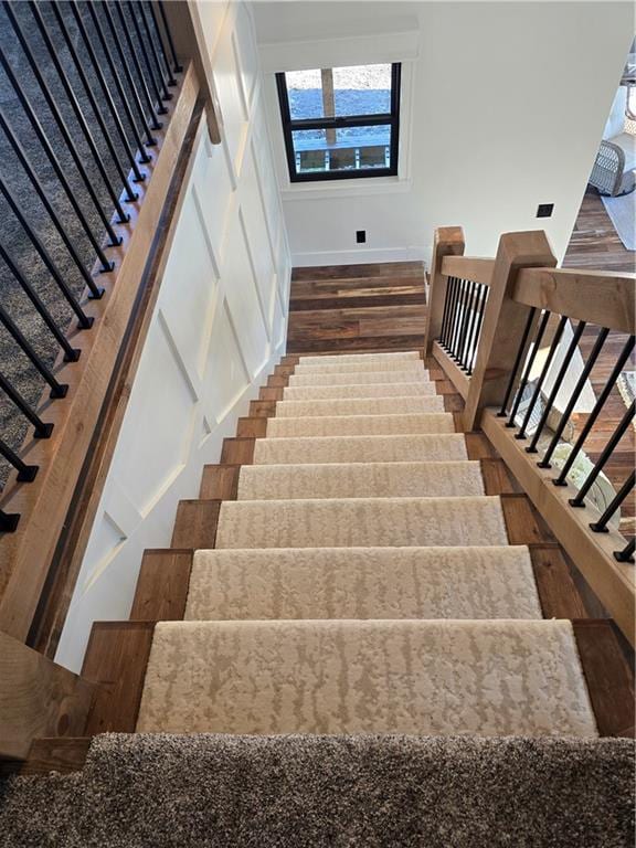 staircase featuring hardwood / wood-style floors