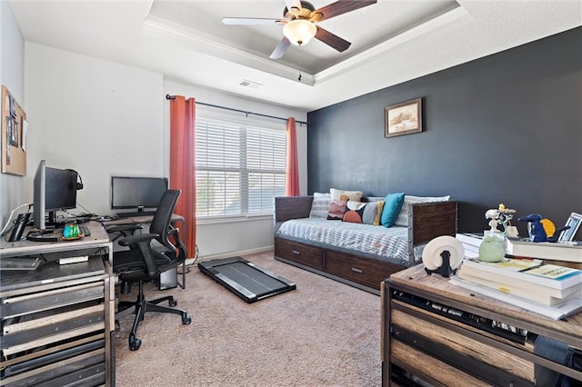 bedroom featuring crown molding, ceiling fan, carpet, and a raised ceiling