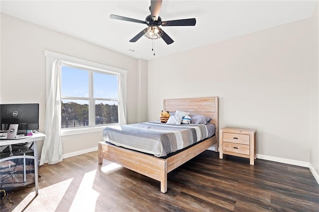 bedroom featuring ceiling fan and dark hardwood / wood-style floors