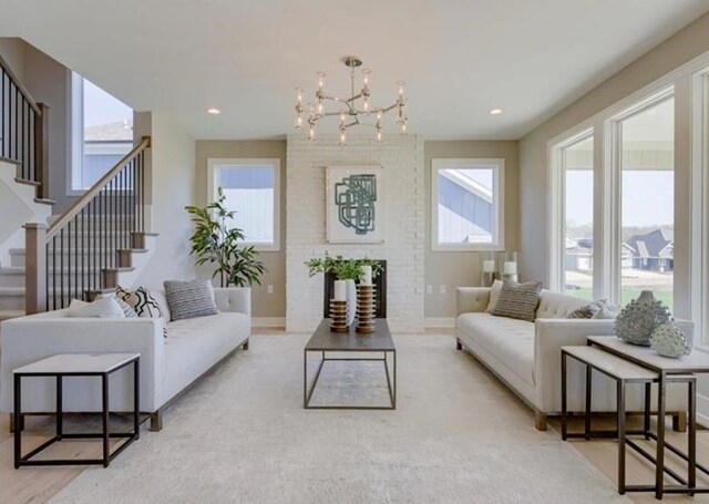9300 Zarda Dr, Lenexa, KS 66227 - living area with a wealth of natural light, a chandelier, stairway, and baseboards