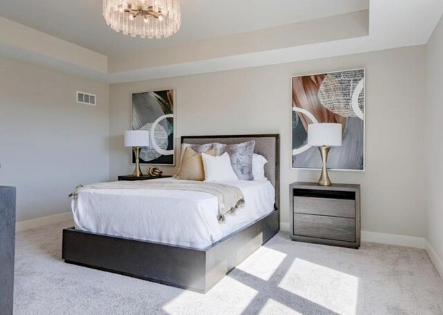 9300 Zarda Dr, Lenexa, KS 66227 - carpeted bedroom featuring a raised ceiling, visible vents, and baseboards