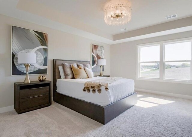 9300 Zarda Dr, Lenexa, KS 66227 - bedroom featuring light colored carpet, visible vents, a notable chandelier, and baseboards