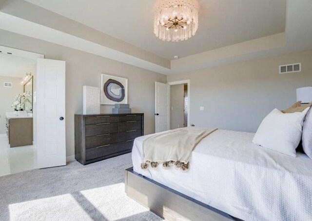9300 Zarda Dr, Lenexa, KS 66227 - carpeted bedroom with an inviting chandelier, a raised ceiling, and visible vents