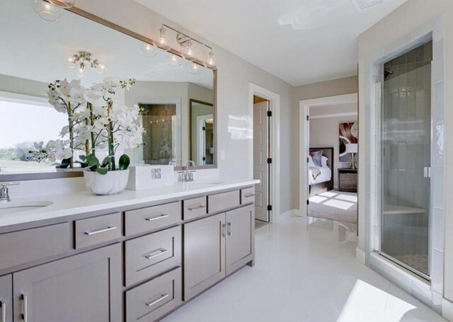 9300 Zarda Dr, Lenexa, KS 66227 - bathroom featuring a stall shower, a sink, and ensuite bathroom