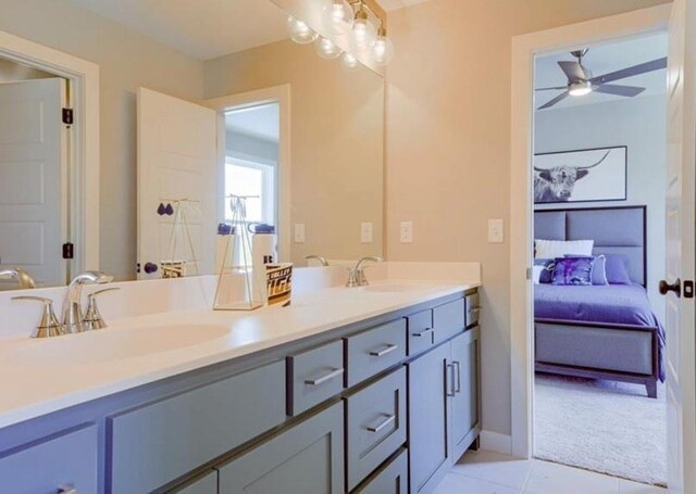 9300 Zarda Dr, Lenexa, KS 66227 - bathroom with a ceiling fan, connected bathroom, double vanity, and a sink