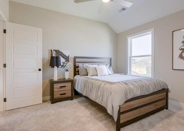 9300 Zarda Dr, Lenexa, KS 66227 - bedroom with ceiling fan, visible vents, light carpet, baseboards, and lofted ceiling