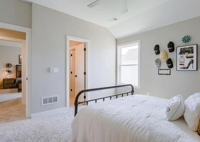 carpeted bedroom with visible vents, ceiling fan, lofted ceiling, and baseboards