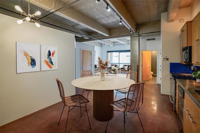 dining area with beam ceiling