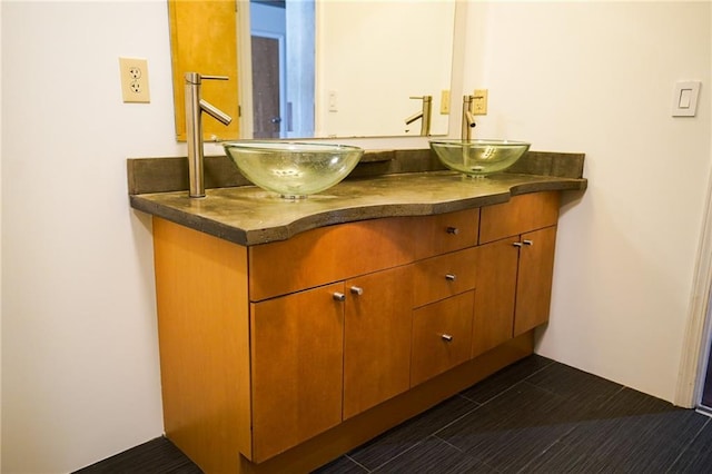 bathroom with tile patterned flooring and vanity