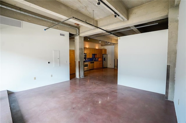 interior space featuring stainless steel fridge