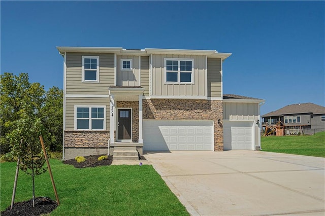 view of front facade featuring a front yard and a garage