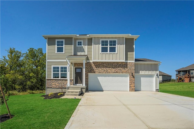 view of front facade with a front yard and a garage